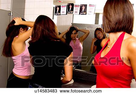 Stock Image - Girls in bathroom. Fotosearch
