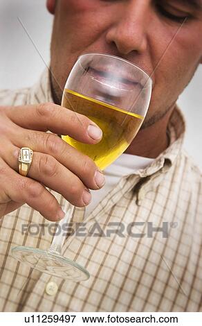 Man holding drink View Large Photo Image Stock Photo - Man holding drink. Fotosearch
