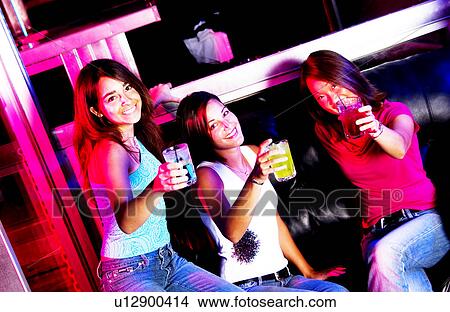 Young adults at a nightclub View Large Photo Image Picture - Young adults at a nightclub. Fotosearch