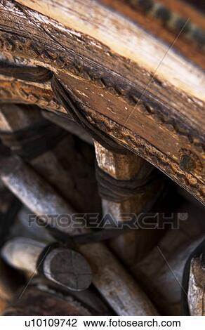 Stock Image - Detail of old wagon wheel. Fotosearch