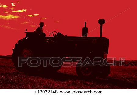 Stock Photo - Tractor in field . Fotosearch