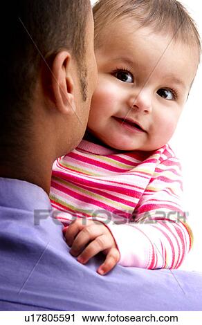 Stock Image - African American father holding daughter. Fotosearch