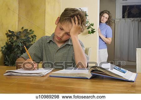 Boy doing homework View Large Photo Image Stock Photo - Boy doing homework. Fotosearch