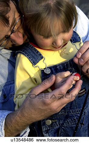 Stock Photograph - Father and daughter fishing. Fotosearch