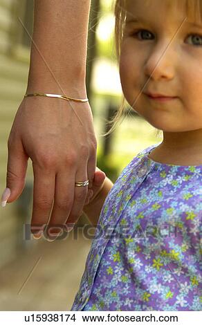 Picture - Girl holding womans hand. Fotosearch