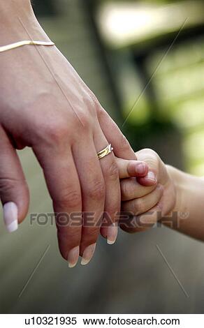 Mother and daughter holding hands View Large Photo Image Stock Photography - Mother and daughter holding hands. Fotosearch