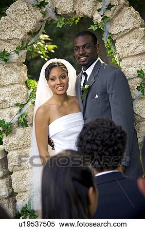 Stock Photography - Bride and Groom at altar. Fotosearch
