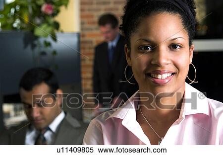 Stock Photography - Businesswoman in office environment. Fotosearch
