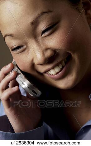 Picture - Woman on cell phone. Fotosearch