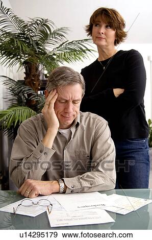 Stock Photo - Couple debating bankruptcy. Fotosearch