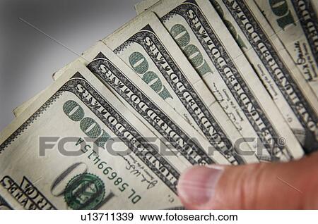 Man holding money View Large Photo Image Stock Photo - Man holding money. Fotosearch