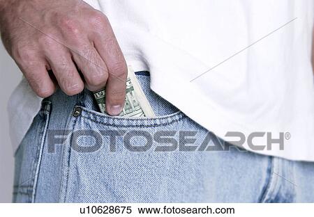 Man putting money in jeans pocket View Large Photo Image Stock Photography - Man putting money in jeans pocket. Fotosearch