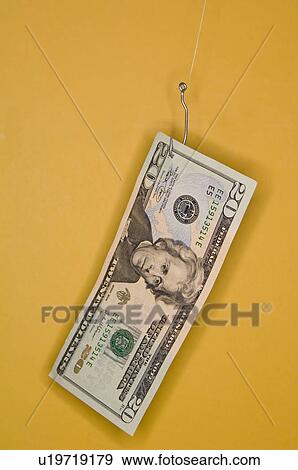 Stock Photo - Twenty dollar bill on a fish hook. Fotosearch