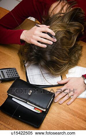 Woman balancing checkbook View Large Photo Image Stock Photography - Woman balancing checkbook. Fotosearch