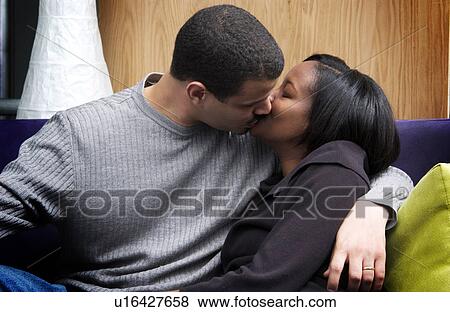Stock Photo - African American couple kissing. Fotosearch
