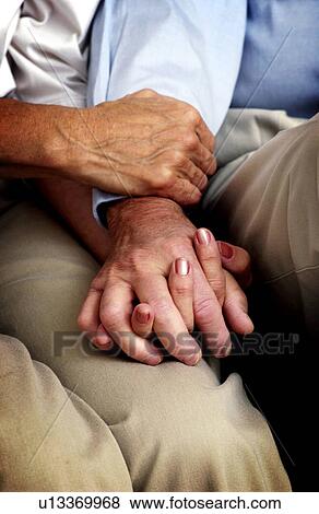 Couple holding hands View Large Photo Image Stock Photo - Couple holding hands. Fotosearch