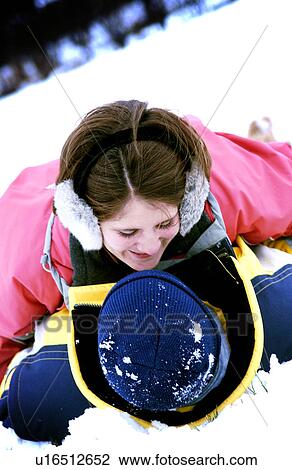 Stock Image - Couple in snow. Fotosearch
