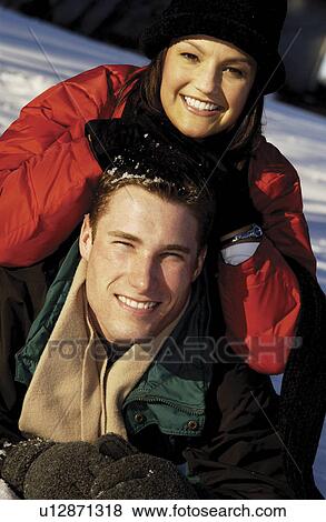 Couple in the snow View Large Photo Image Stock Photo - Couple in the snow. Fotosearch