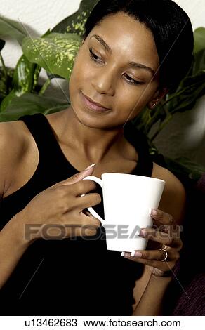 African American woman drinking coffee View Large Photo Image Stock Image - African American woman drinking coffee. Fotosearch