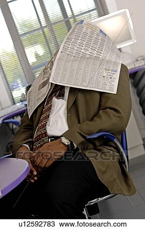 Businessman with newspaper over his head View Large Photo Image Stock Image - Businessman with newspaper over his head. Fotosearch