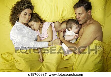 Family in bed View Large Photo Image Stock Photo - Family in bed. Fotosearch