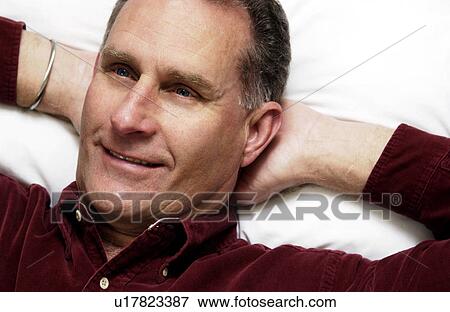 Man lying down View Large Photo Image Stock Photo - Man lying down. Fotosearch