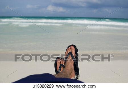 Mans feet on beach View Large Photo Image Stock Photo - Mans feet on beach. Fotosearch
