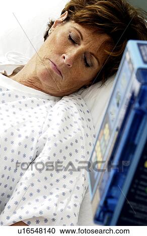 Patient in hospital bed View Large Photo Image Stock Image - Patient in hospital bed. Fotosearch