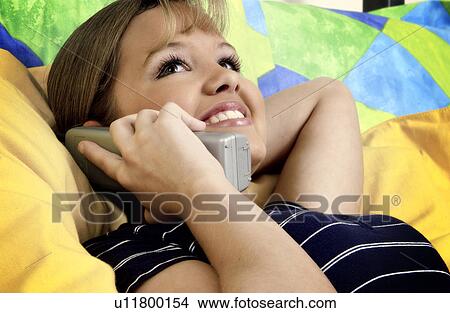 Picture - Teen talking on phone. Fotosearch