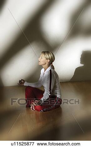 Stock Photo - Woman doing yoga. Fotosearch