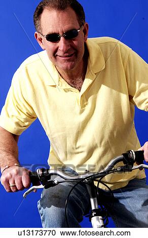 Stock Image - Man riding a bicycle. Fotosearch