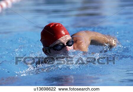 Stock Image - Man Swimming in pool. Fotosearch
