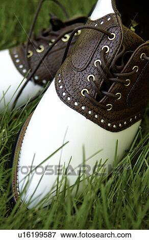Pair of golf shoes in the green grass View Large Photo Image Stock Photo - Pair of golf shoes in the green grass. Fotosearch