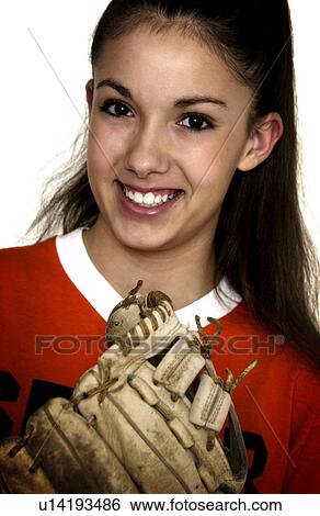 Stock Photograph - Teen playing softball. Fotosearch