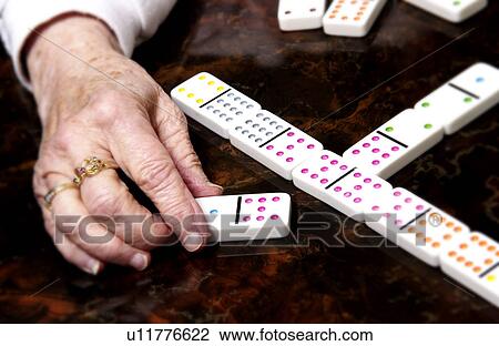 Woman playing dominoes View Large Photo Image Stock Image - Woman playing dominoes. Fotosearch