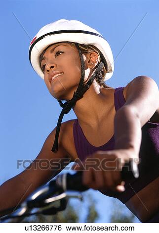 Woman riding bicycle View Large Photo Image Stock Photograph - Woman riding bicycle. Fotosearch