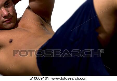 Man doing sit ups Man doing sit ups View Large Photo Image Stock Image - Man doing sit ups Man doing sit ups . Fotosearch