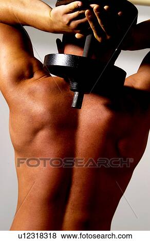 Man with barbell View Large Photo Image Stock Photo - Man with barbell. Fotosearch
