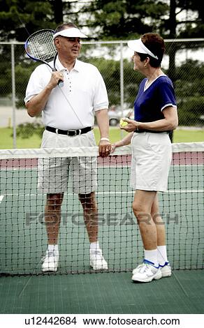 Picture - Senior couple playing tennis. Fotosearch
