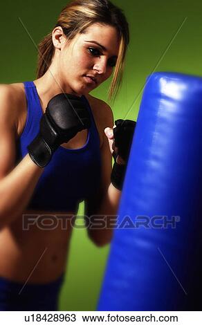 Woman practicing boxing View Large Photo Image Stock Image - Woman practicing boxing. Fotosearch