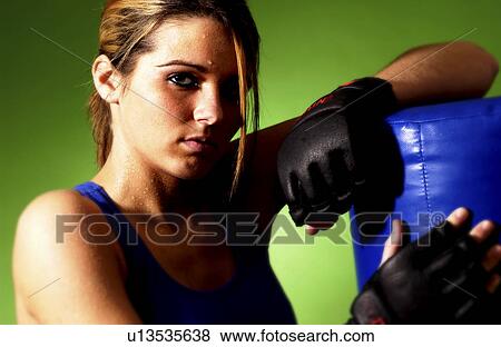 Stock Photo - Woman practicing boxing. Fotosearch