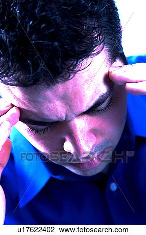 Stock Image - Man with headache. Fotosearch