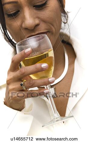 Stock Image - Woman holding drink. Fotosearch