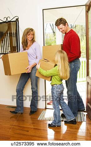 Family moving into new home View Large Photo Image Stock Photography - Family moving into new home. Fotosearch