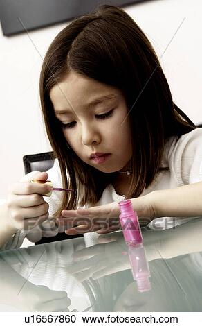 Girl painting her nails View Large Photo Image Stock Image - Girl painting her nails. Fotosearch