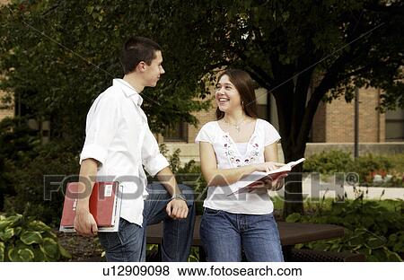 Kids hanging out on campus View Large Photo Image Stock Photo - Kids hanging out on campus. Fotosearch