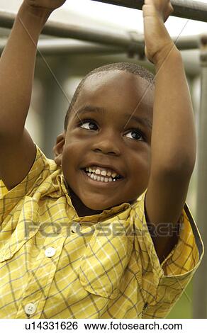 African American boy on playground View Large Photo Image Stock Photograph - African American boy on playground. Fotosearch