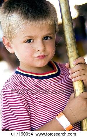 Picture - Boy on merry go round. Fotosearch