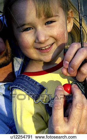 Stock Image - Father and daughter fishing. Fotosearch