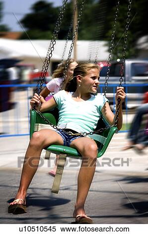 Stock Photography - Girl on carnival ride. Fotosearch